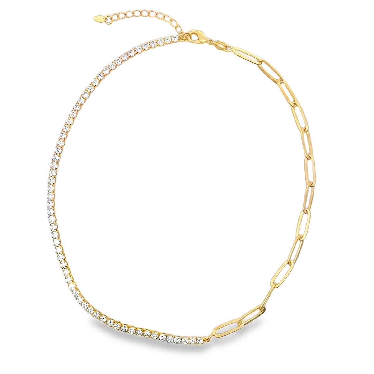 A gold half-paperclip and half-diamond tennis necklace rests against a white background.