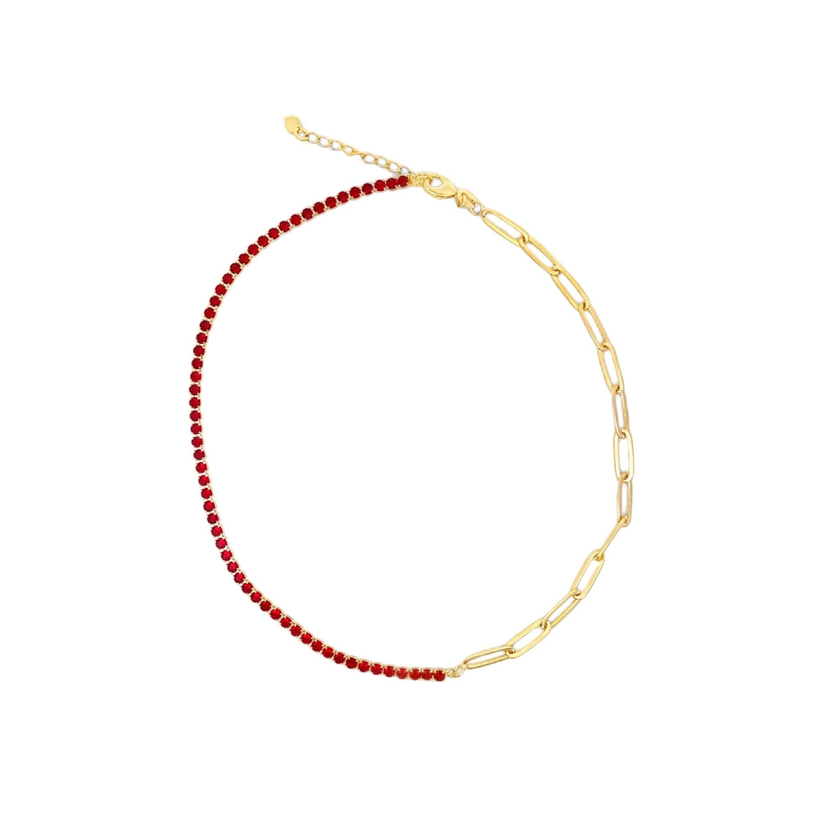 A gold-plated half-tennis necklace features one side of sparkling red crystal stones and the other side of chunky paperclip chain links against a clean white background.