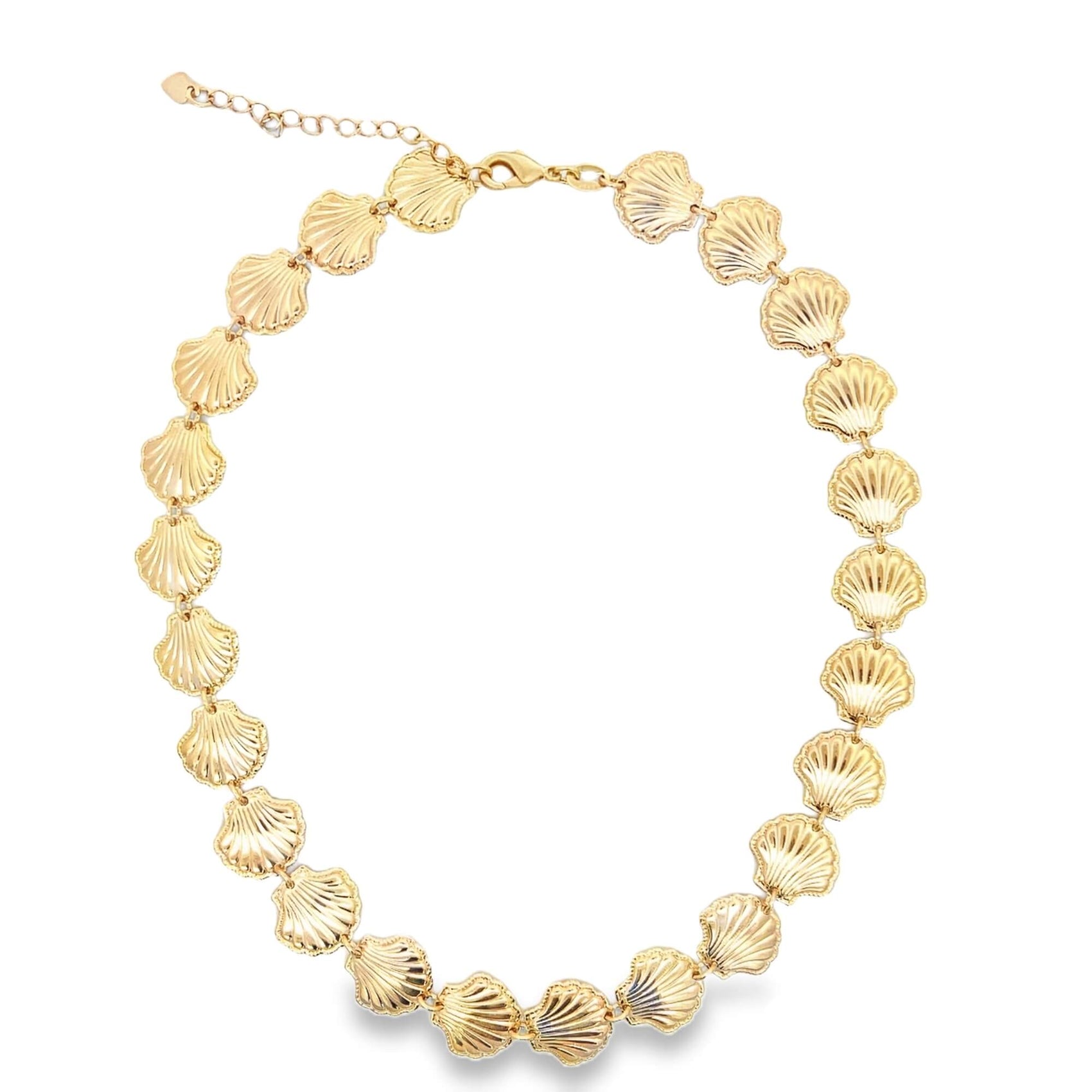 A gold seashell statement choker necklace rests on a clean white background.