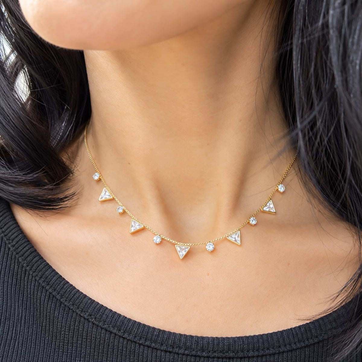 Shop the Triangle Charm Station Necklace featuring faceted triangle stones and sparkling CZ accents on a delicate chain. Available in clear and colorful variations.
