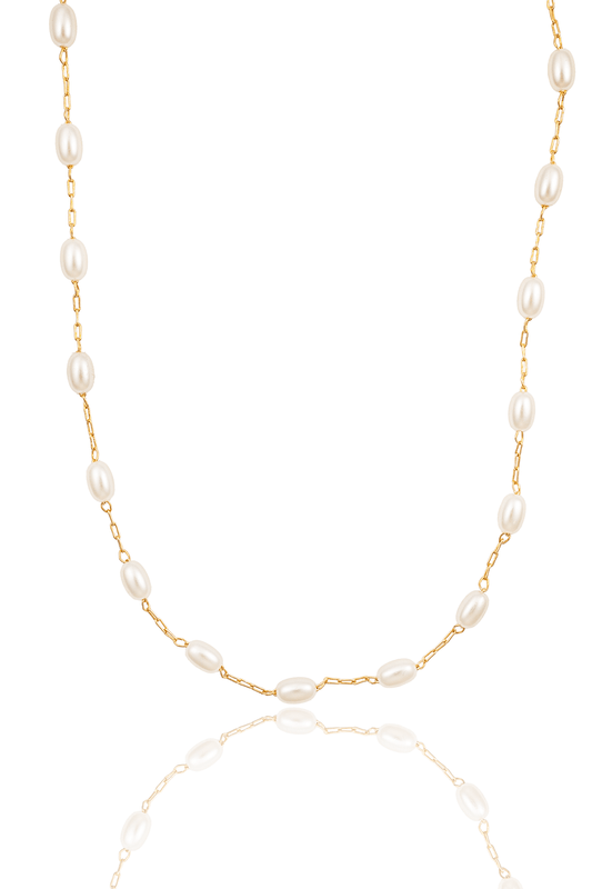 A delicate gold chain necklace features evenly spaced, luminous freshwater pearls against a clean white background.