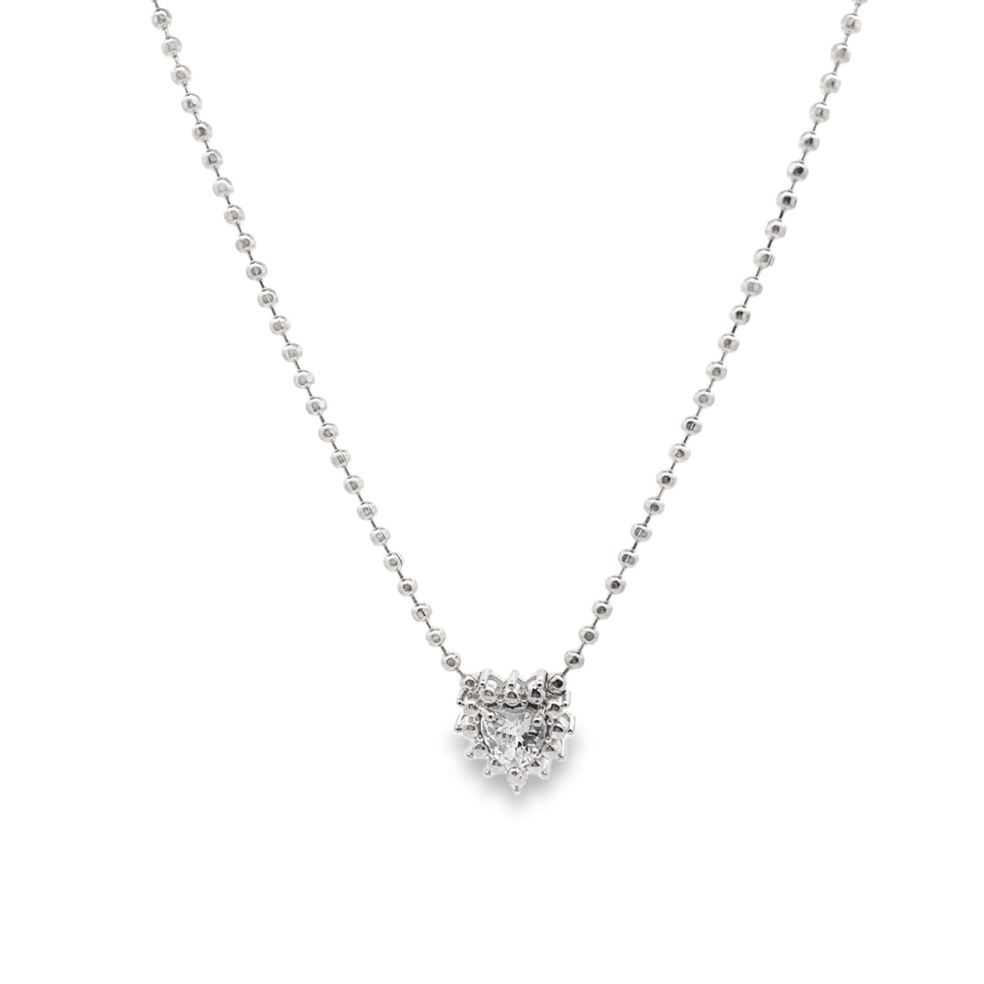 Silver necklace with a heart-shaped pendant on a white background