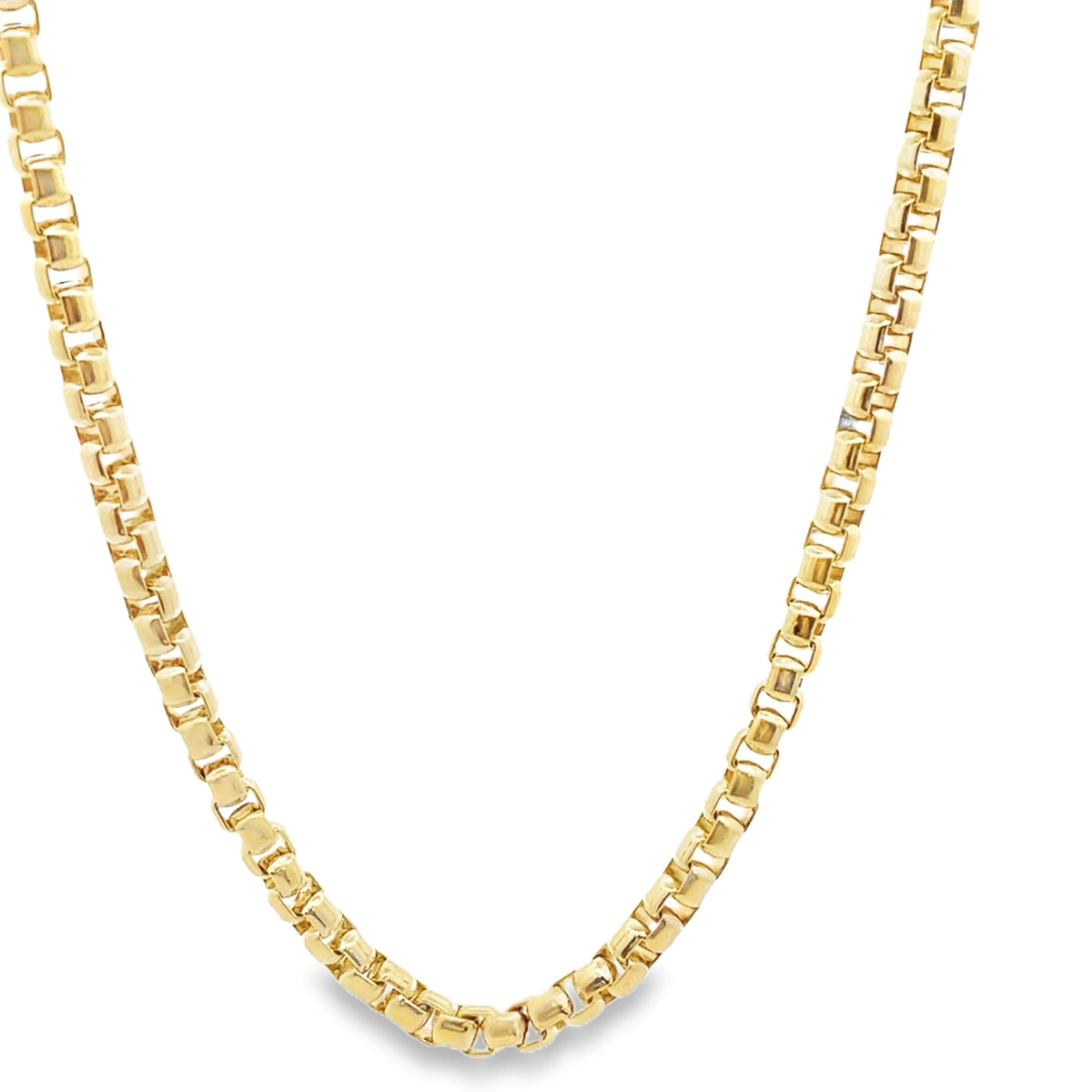 A polished gold box chain necklace curves gracefully against a plain white background.
