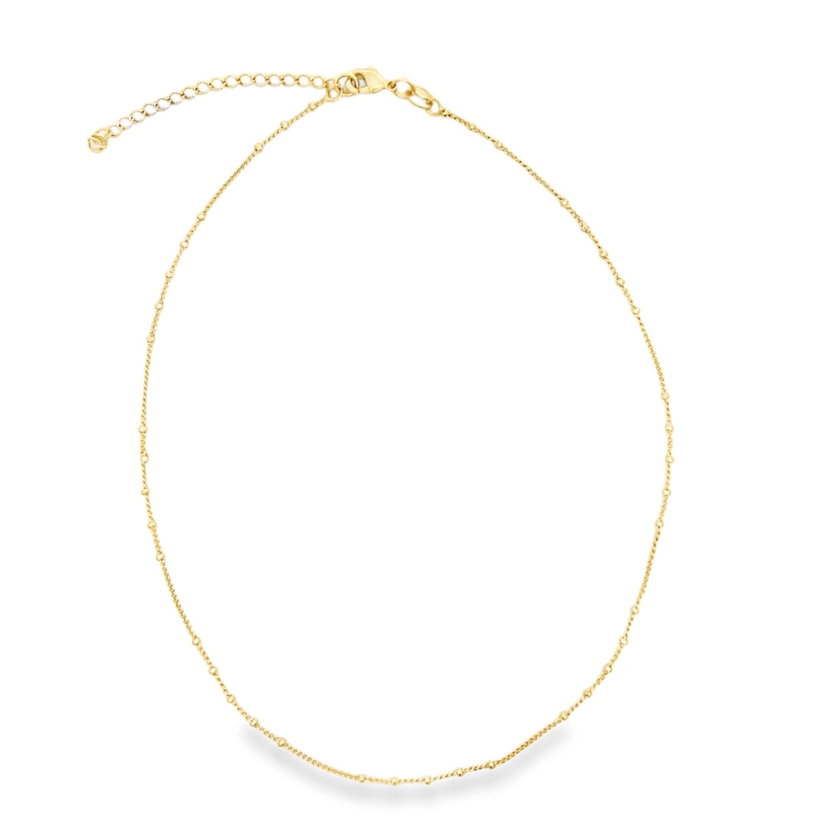 A delicate gold chain necklace with a clasp lies against a plain white background.