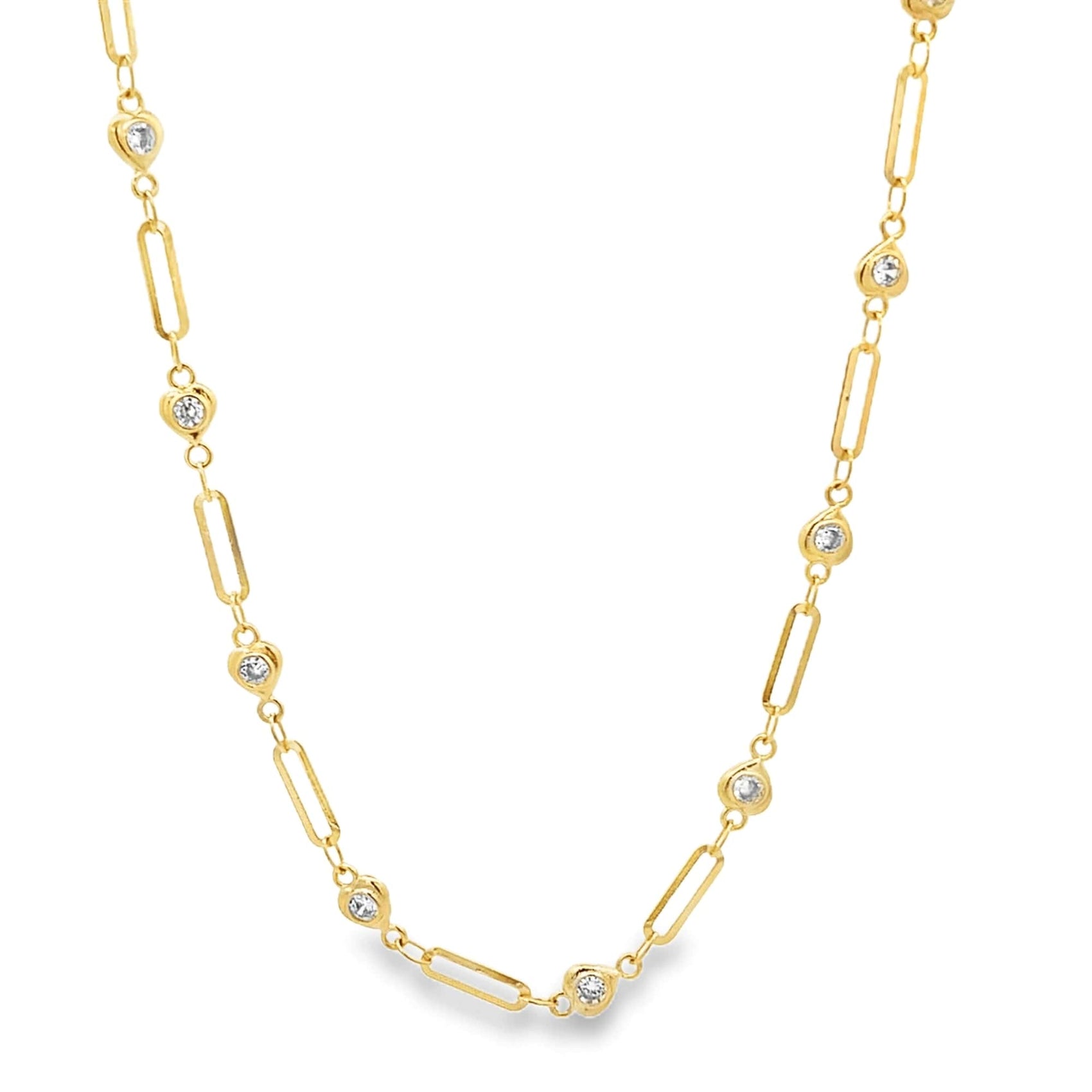 A delicate gold paperclip chain necklace features alternating diamond bezel stations against a plain white background.