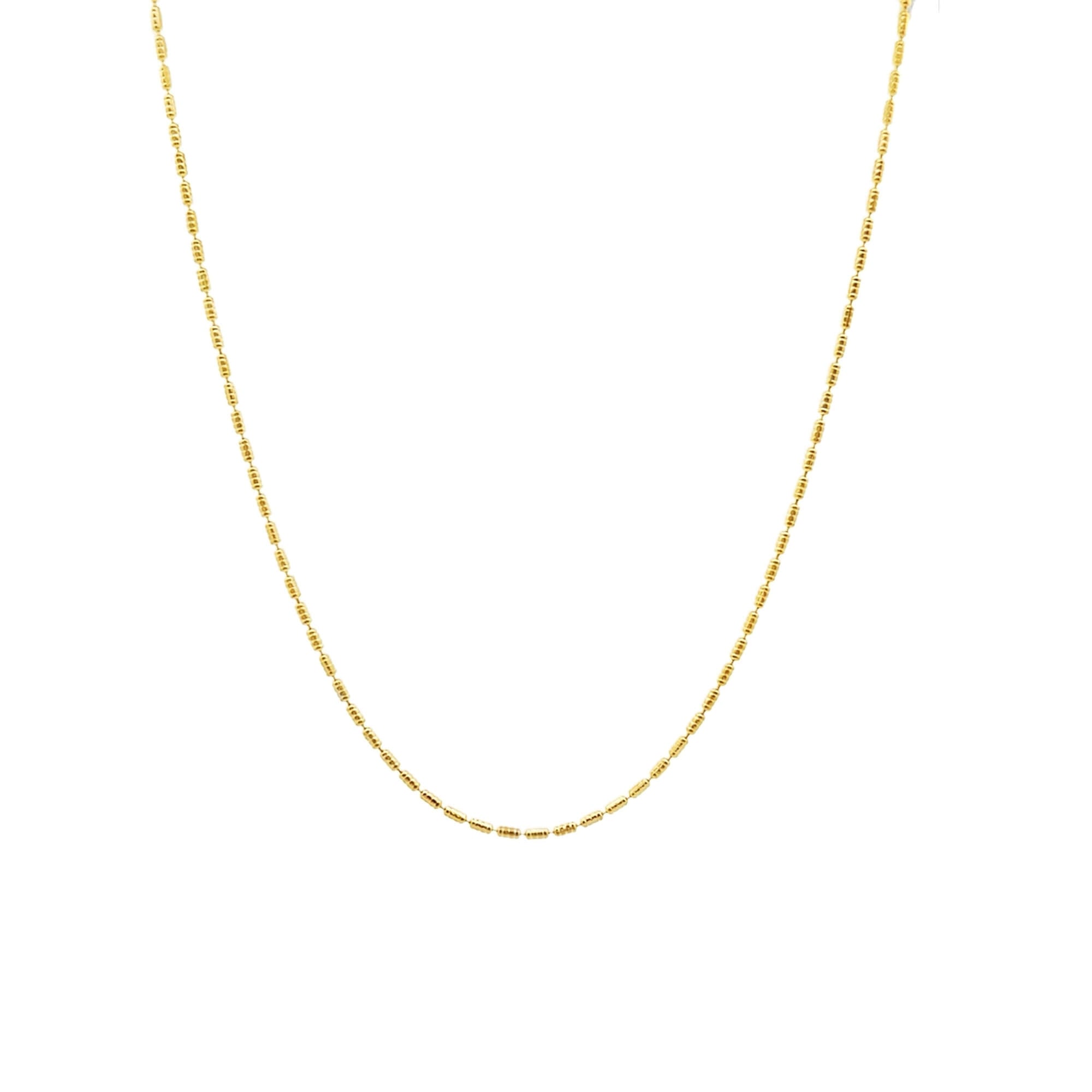 Gold chain necklace on a white background