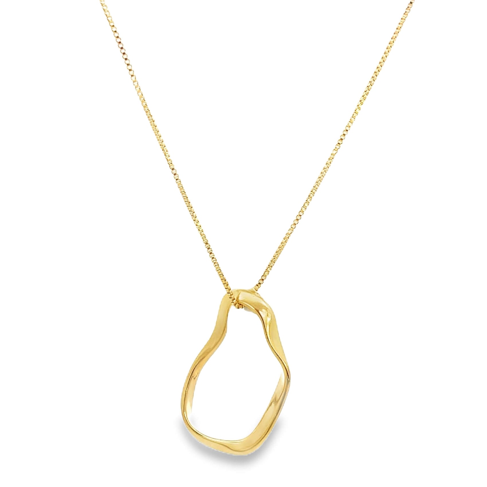 A delicate gold necklace features a uniquely sculpted, organic-shaped pendant dangling from a fine box chain.