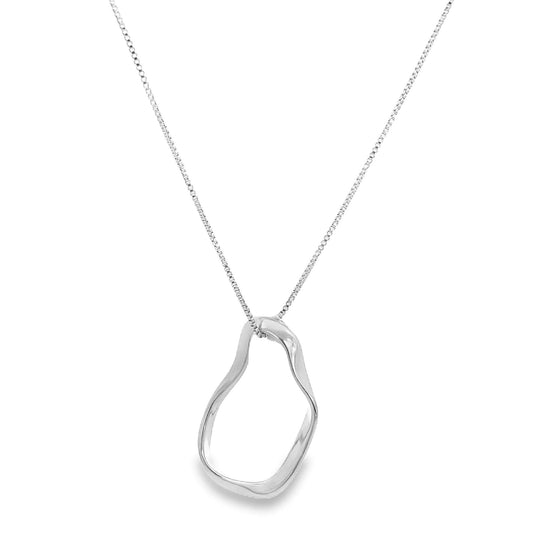 A delicate silver box chain necklace holds a polished, organically shaped abstract pendant against a white background.