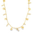 A delicate gold charm necklace features alternating coin-shaped pendants and sparkling crystal drops along its chain against a white background.