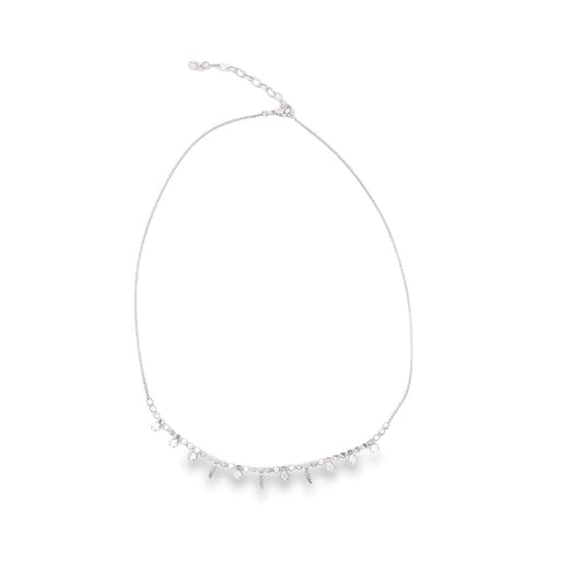 A delicate silver necklace features dangling leaf charms and sparkling crystal droplets against a plain white background.