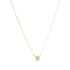 A delicate gold chain necklace hangs against a white background, featuring a small heart-shaped diamond pendant at its center.
