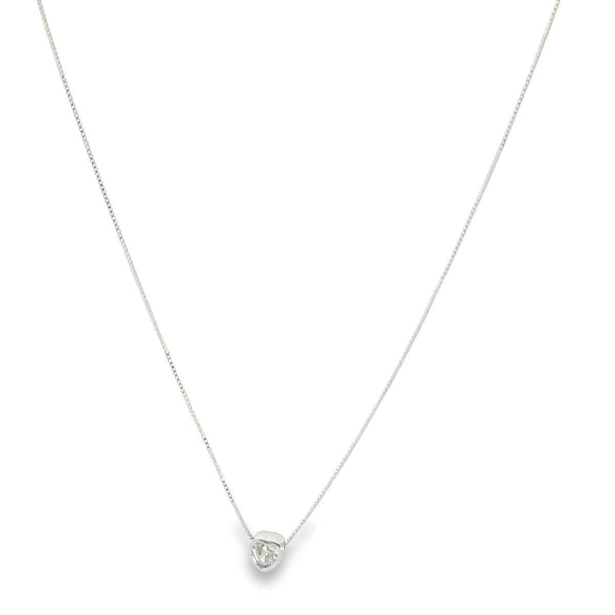 A delicate silver box chain necklace features a sparkling heart-shaped diamond pendant centered on a clean white background.