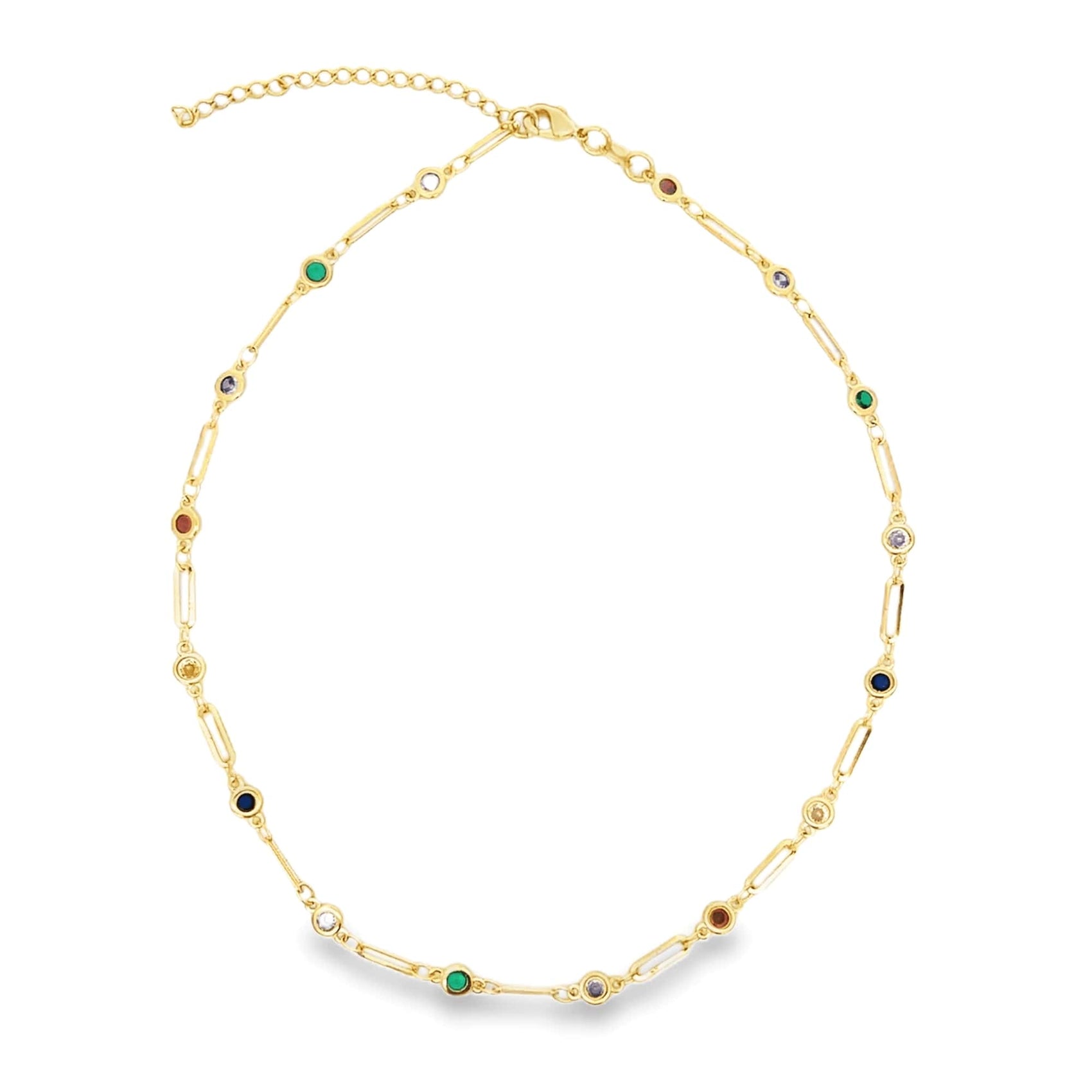 A delicate gold link necklace sparkles against a white background, featuring interspersed colorful gemstone stations.