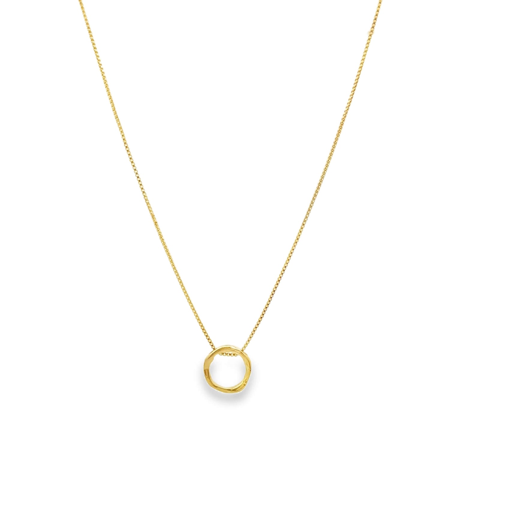 Gold necklace with a small round pendant on a white background