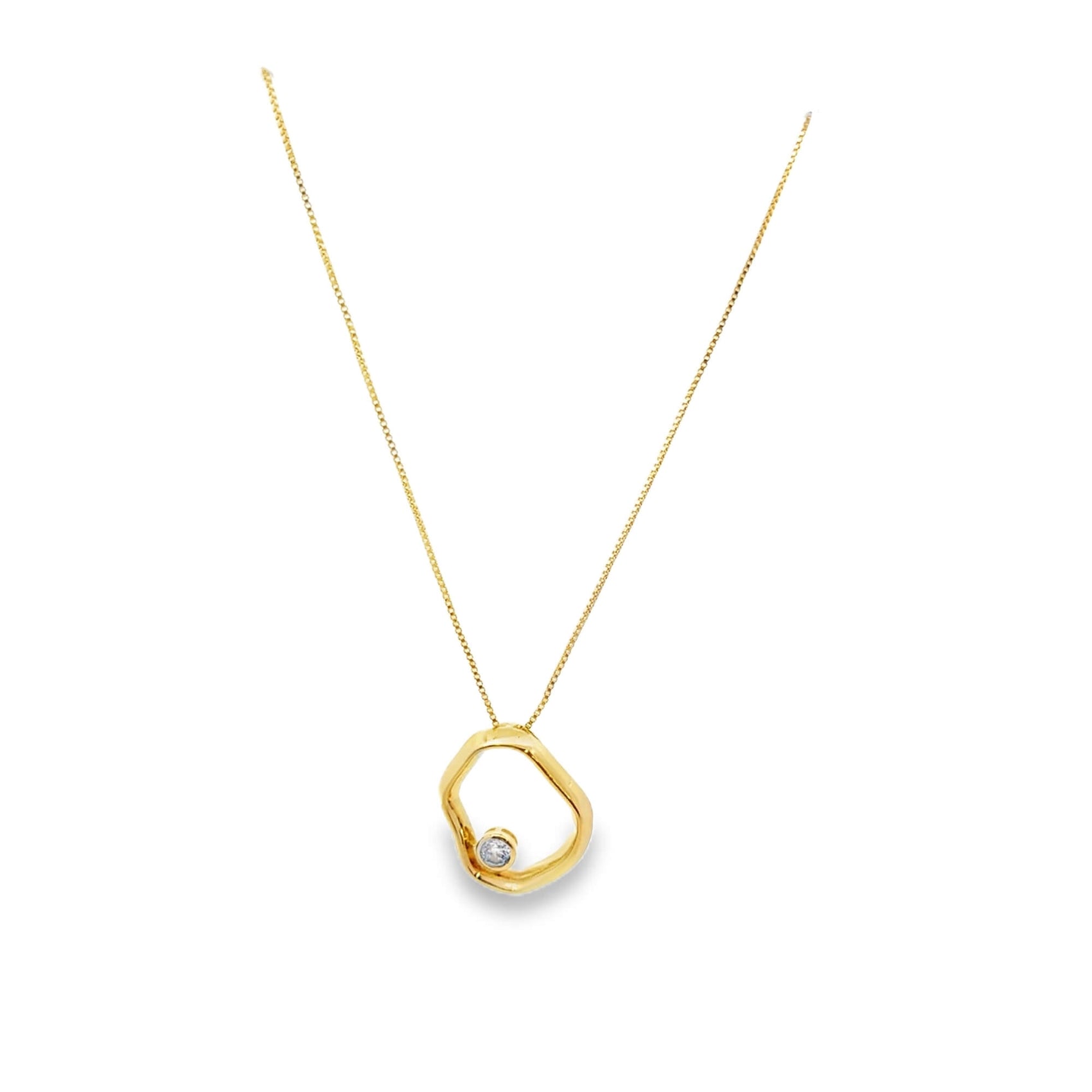 Gold necklace with a unique pendant on a white background