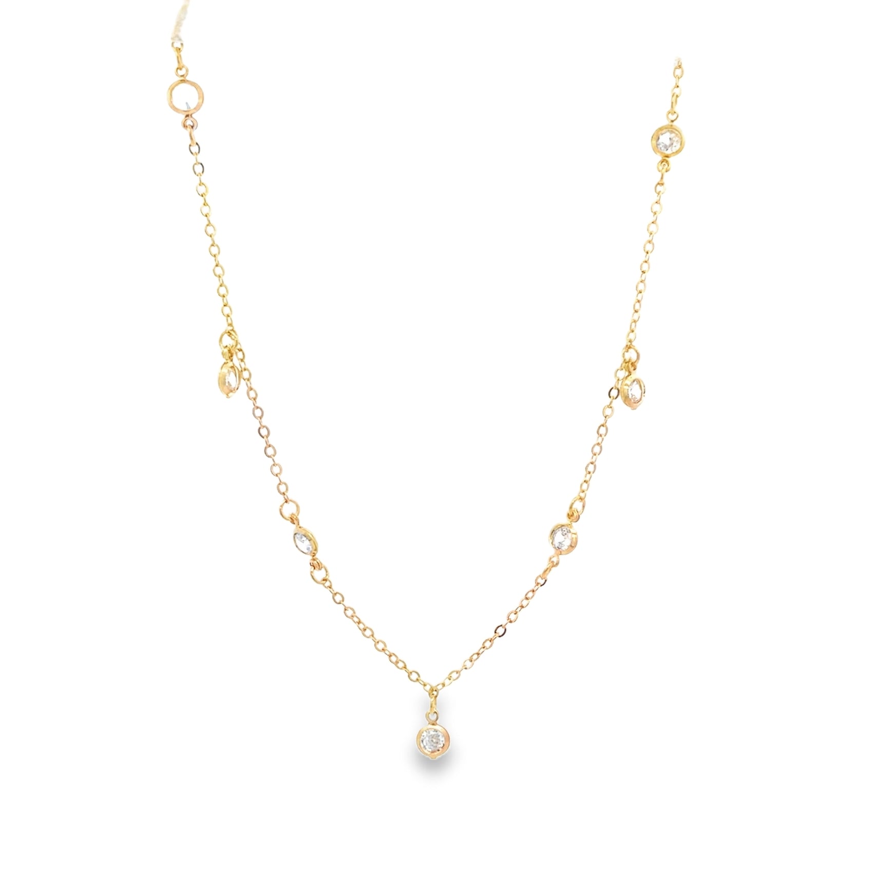 A delicate gold chain necklace sparkles with multiple bezel-set diamond station charms against a clean white background.