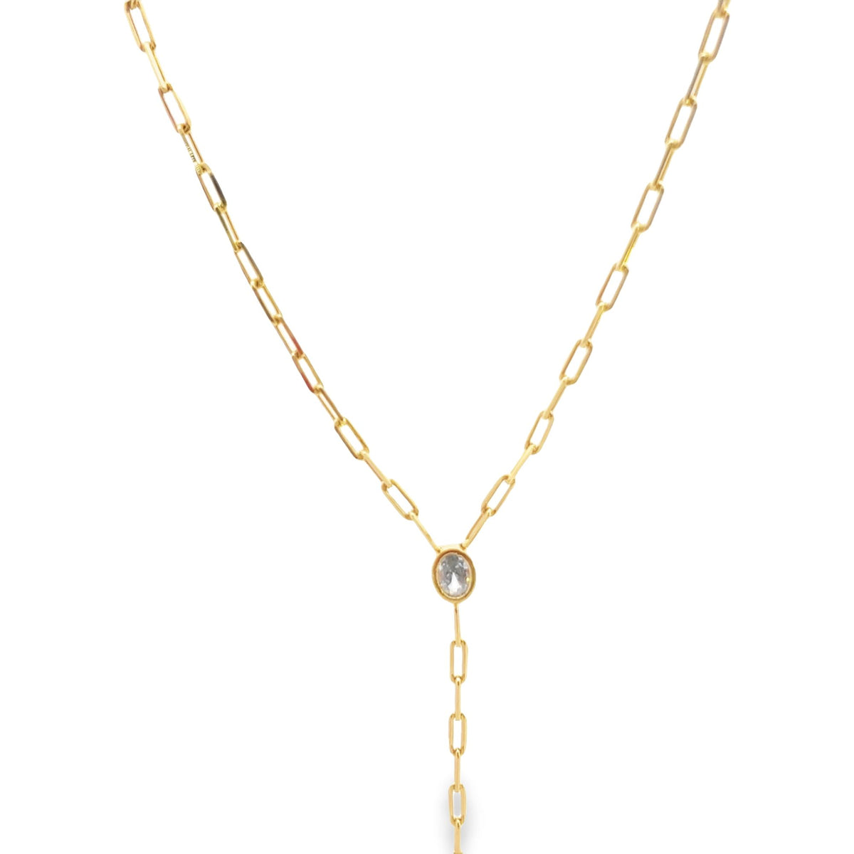 A delicate gold paperclip chain necklace features a sparkling bezel-set oval gemstone hanging in a Y-shape against a clean white background.