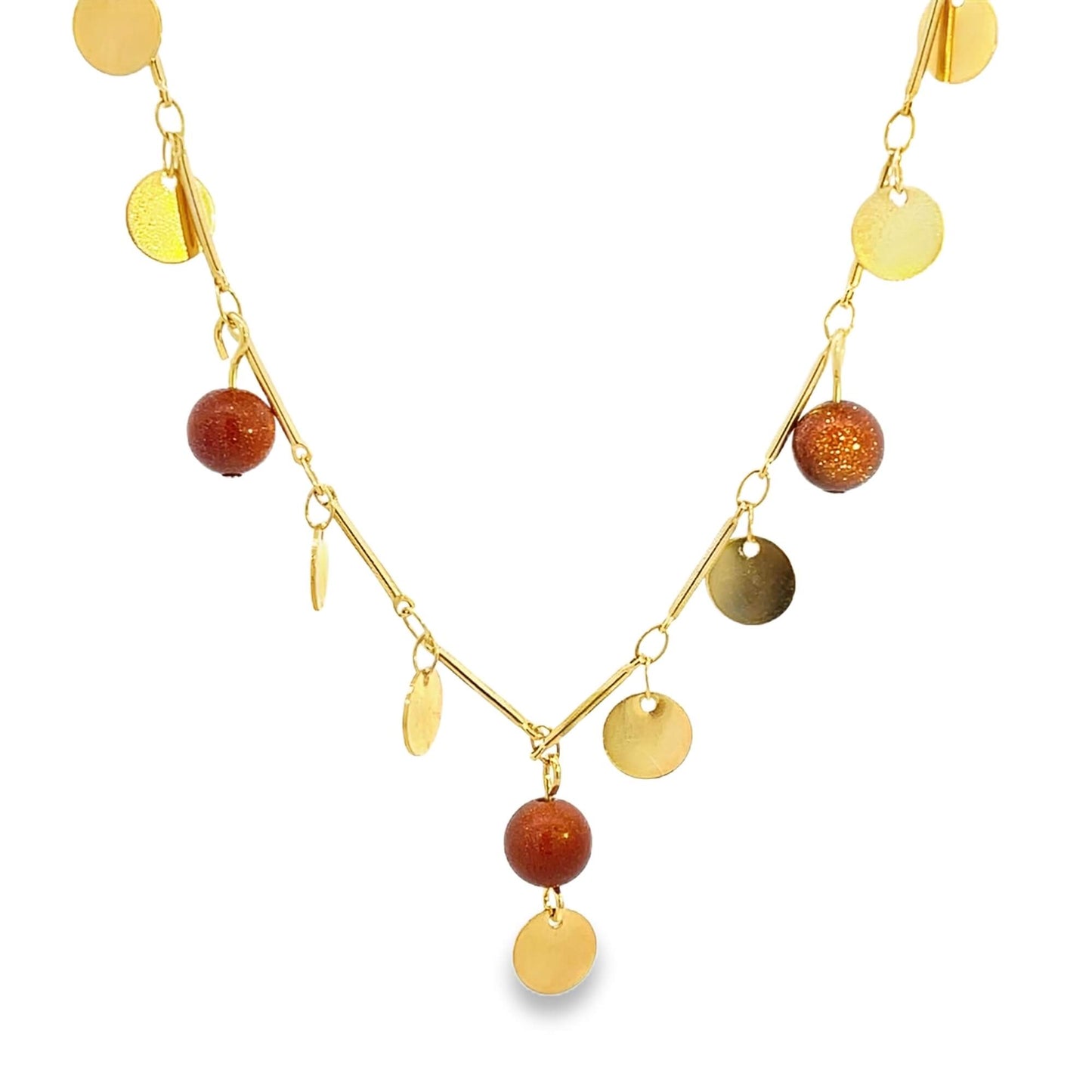 A delicate gold necklace features sparkling brown gemstone beads and dangling coin charms against a white background.