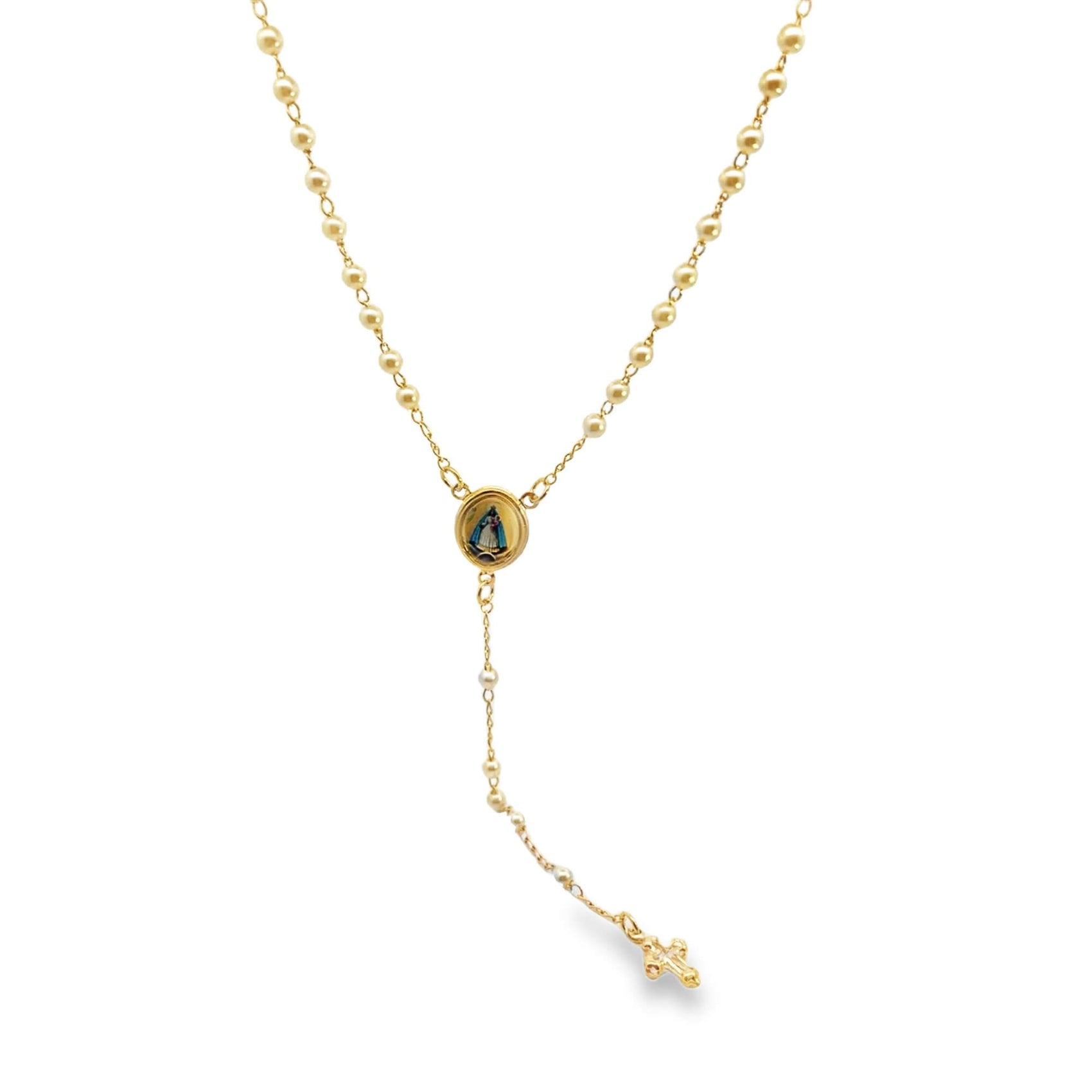 A delicate gold rosary necklace features glossy pearl beads, a circular centerpiece depicting the Virgin Mary, and a small crucifix pendant dangling on a white background.