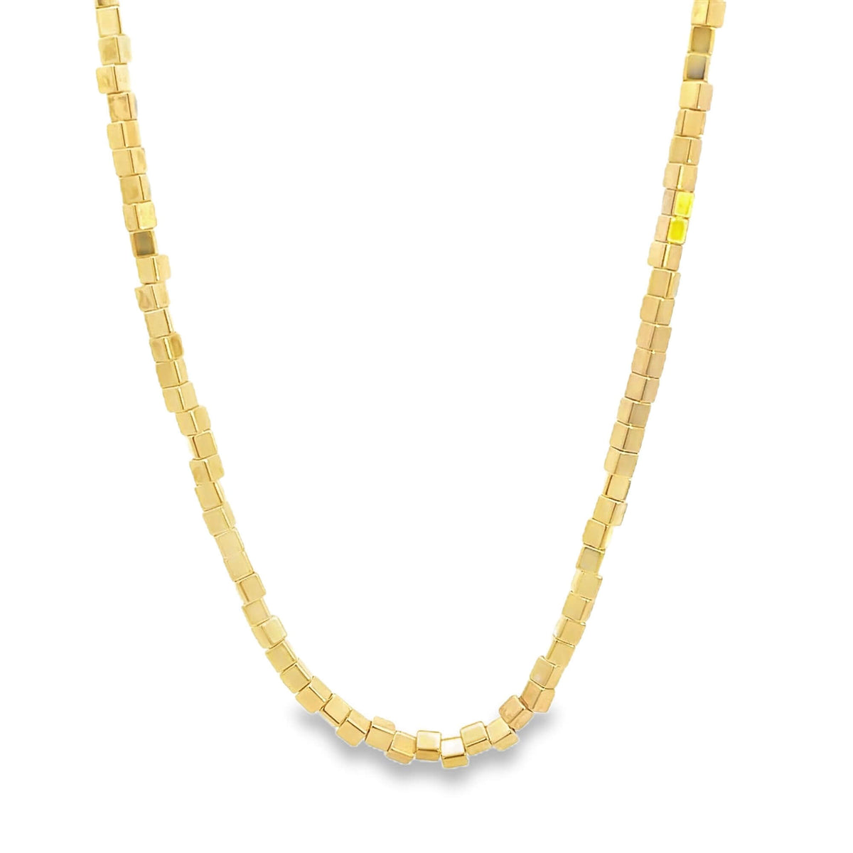 A dainty gold chain necklace features interlocking small cube beads against a clean white background.