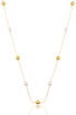 A delicate gold chain necklace drapes with alternating gold beads and white pearls against a clean white background.