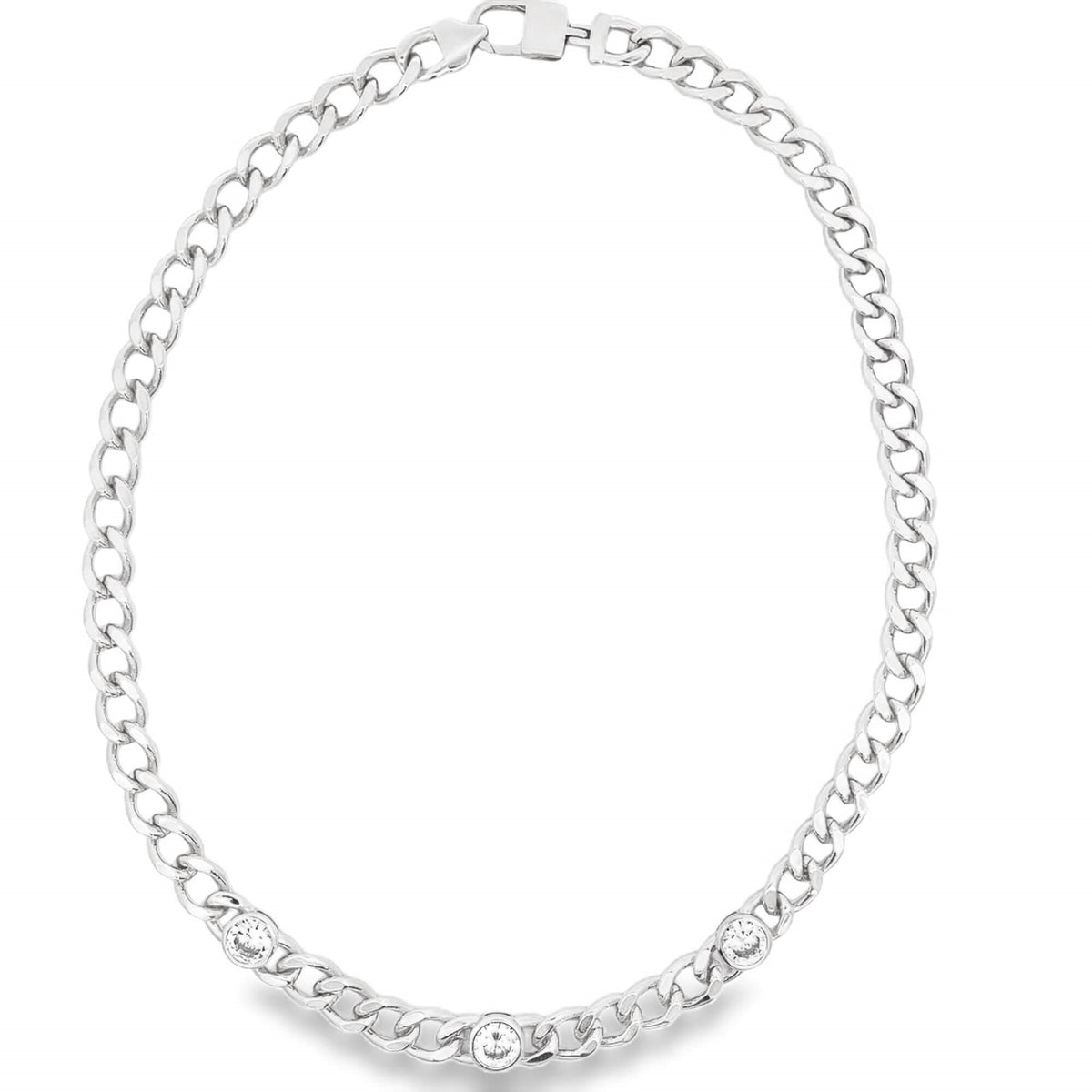 A silver curb chain necklace features three sparkling rhinestone crystals embedded along the front links.