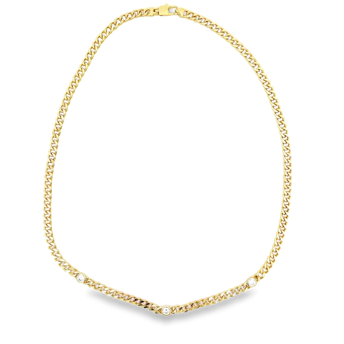 A polished gold curb chain necklace features three sparkling round-cut diamonds bezel-set along the lower links.