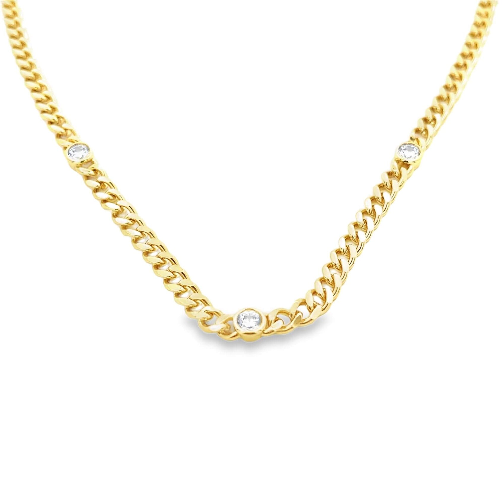 A gleaming gold chain necklace features three bezel-set round diamonds sparkling along its links.
