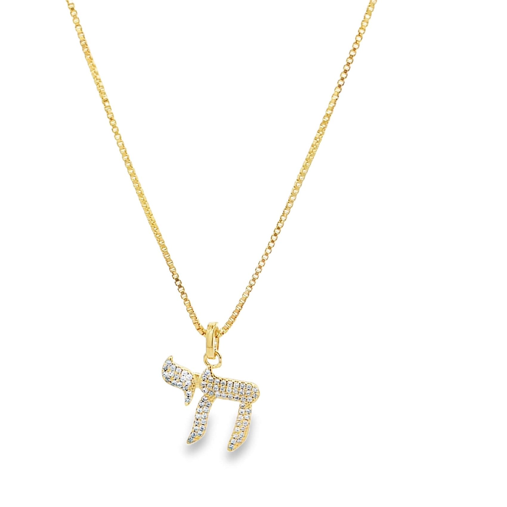 A gold Chai pendant sparkling with pavé diamonds hangs gracefully from a delicate matching chain against a clean white background.