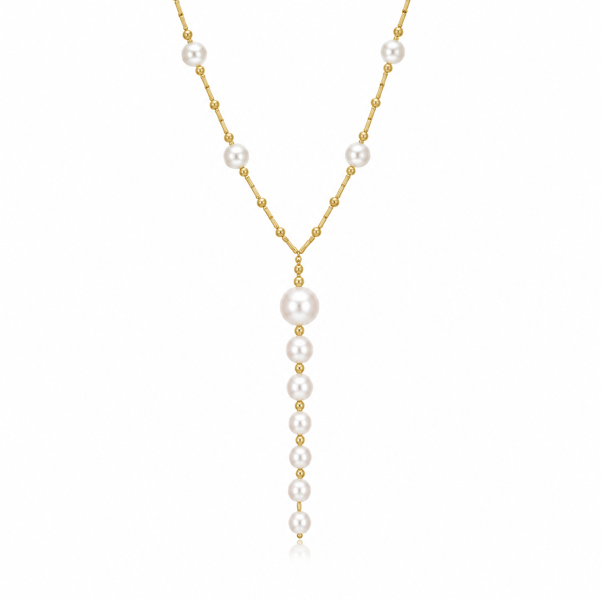 A delicate gold lariat necklace features a vertical drop of graduated white pearls interspersed with tiny gold beads against a clean white background.