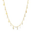 A delicate gold chain necklace drapes against a white background, featuring dangling star charms and sparkling crystal accents.