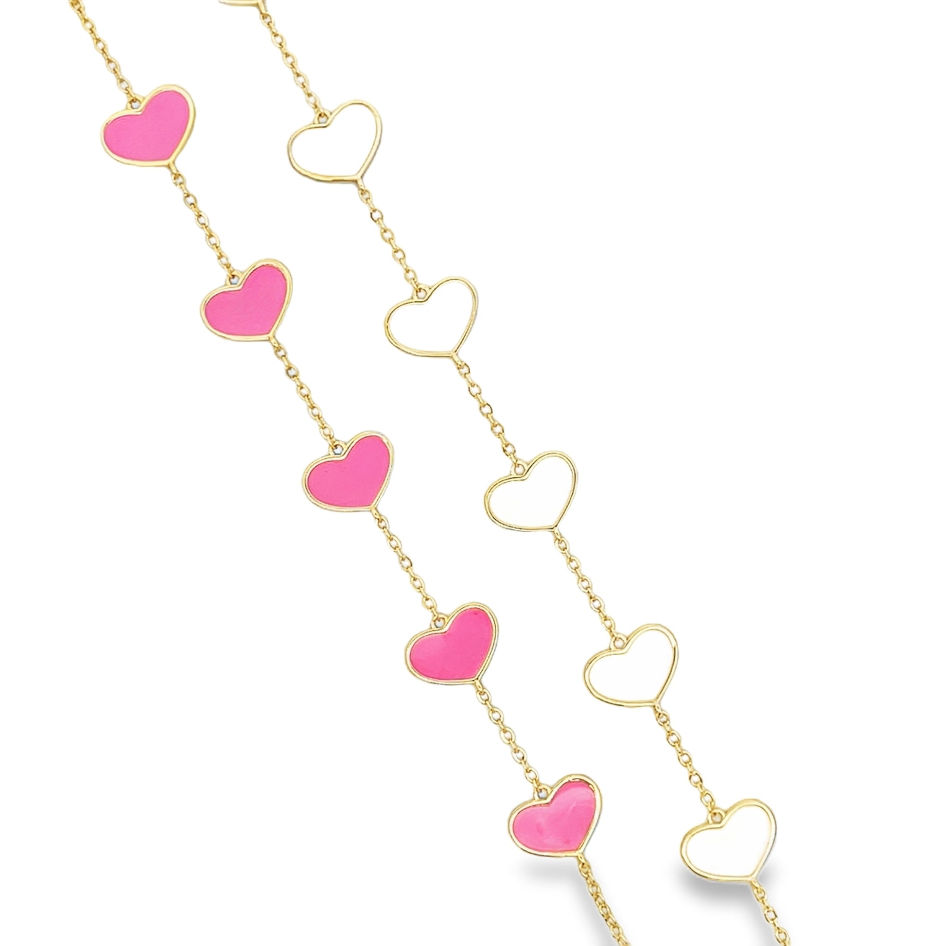 Two gold chains feature alternating pink enamel and hollow openwork heart charms against a white background.