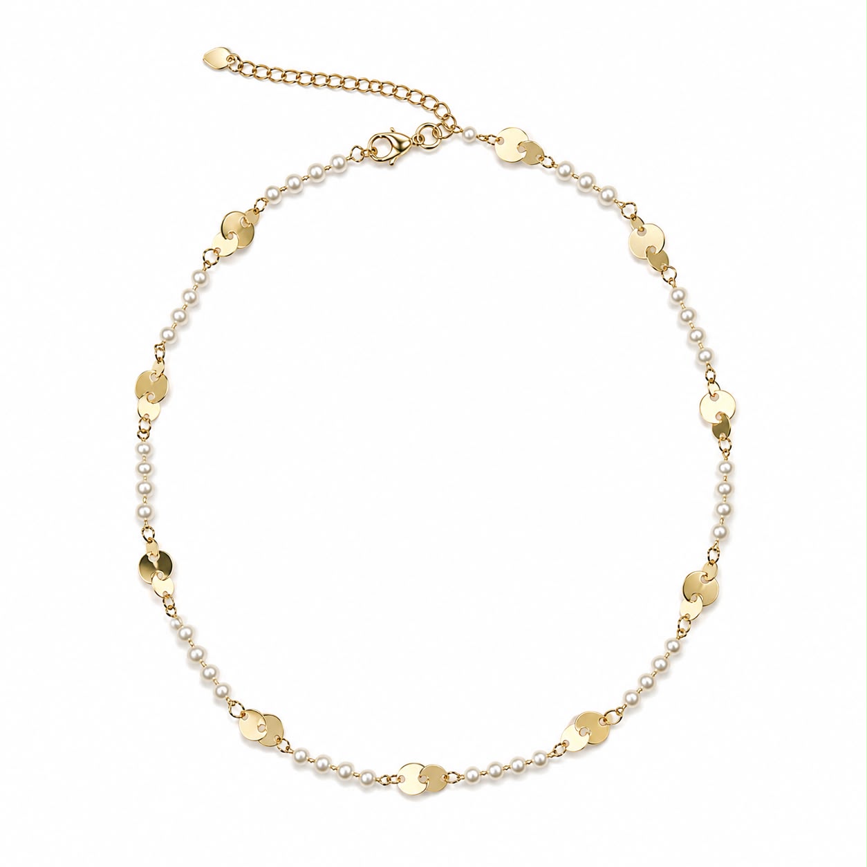 A delicate gold chain necklace features alternating small pearls and flat round gold discs arranged in a circle against a white background.