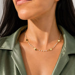Elegant 18K Gold Filled station necklace featuring polished coin discs and round synthetic pearls. Lightweight, timeless and perfect for layering or everyday wear.