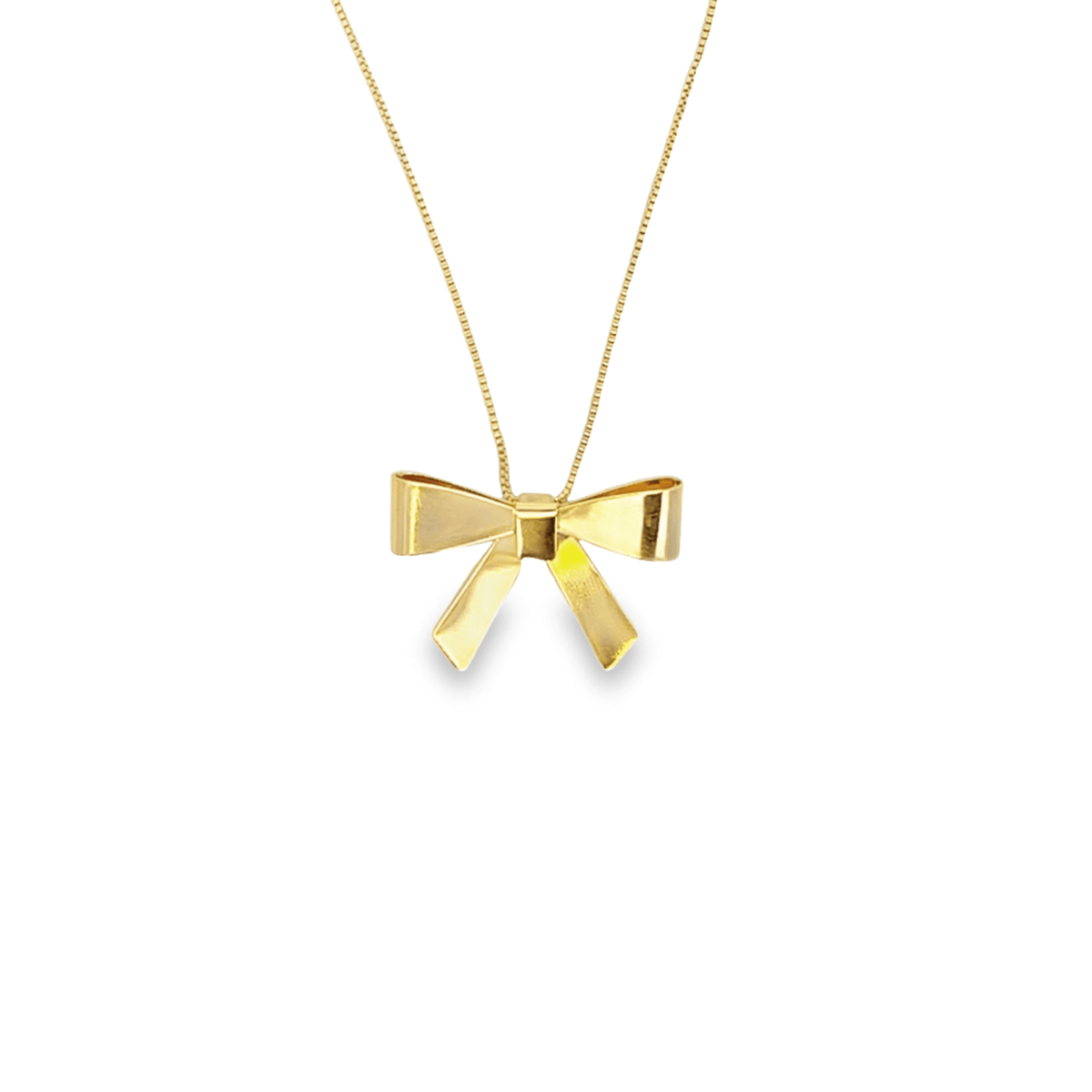 A delicate gold bow pendant necklace hangs centered against a clean white background.