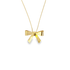 A delicate gold bow pendant necklace hangs centered against a clean white background.