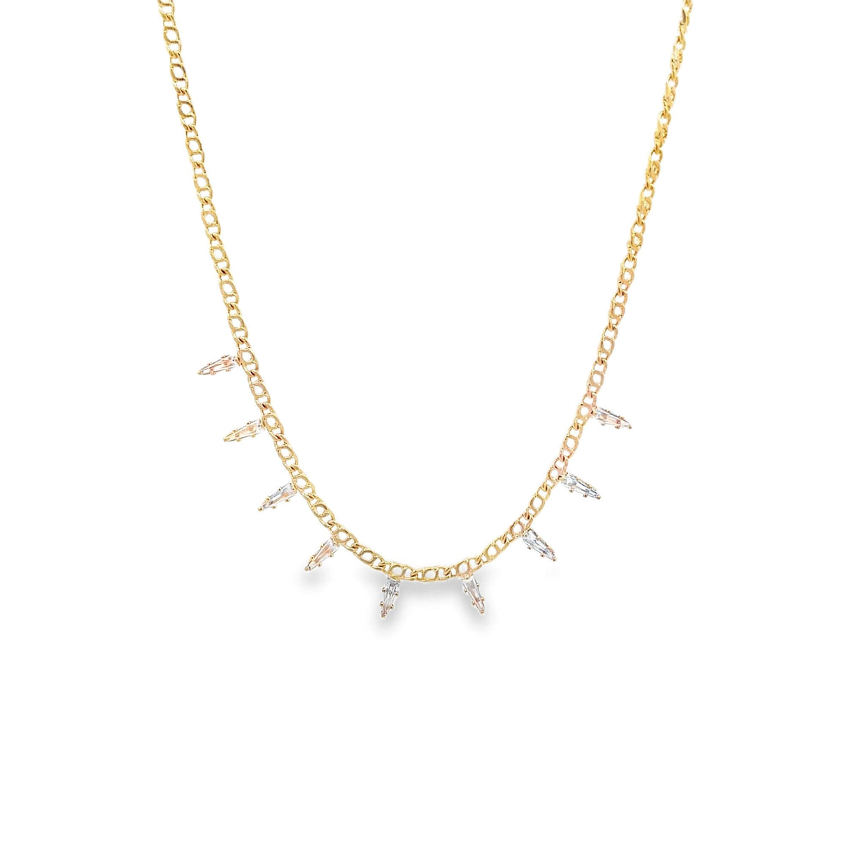 A delicate gold chain necklace dangles small crystal spike charms against a white background.