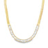 A gold herringbone chain necklace features a dazzling crescent of rectangular baguette-cut cubic zirconia stones nestled along the front.