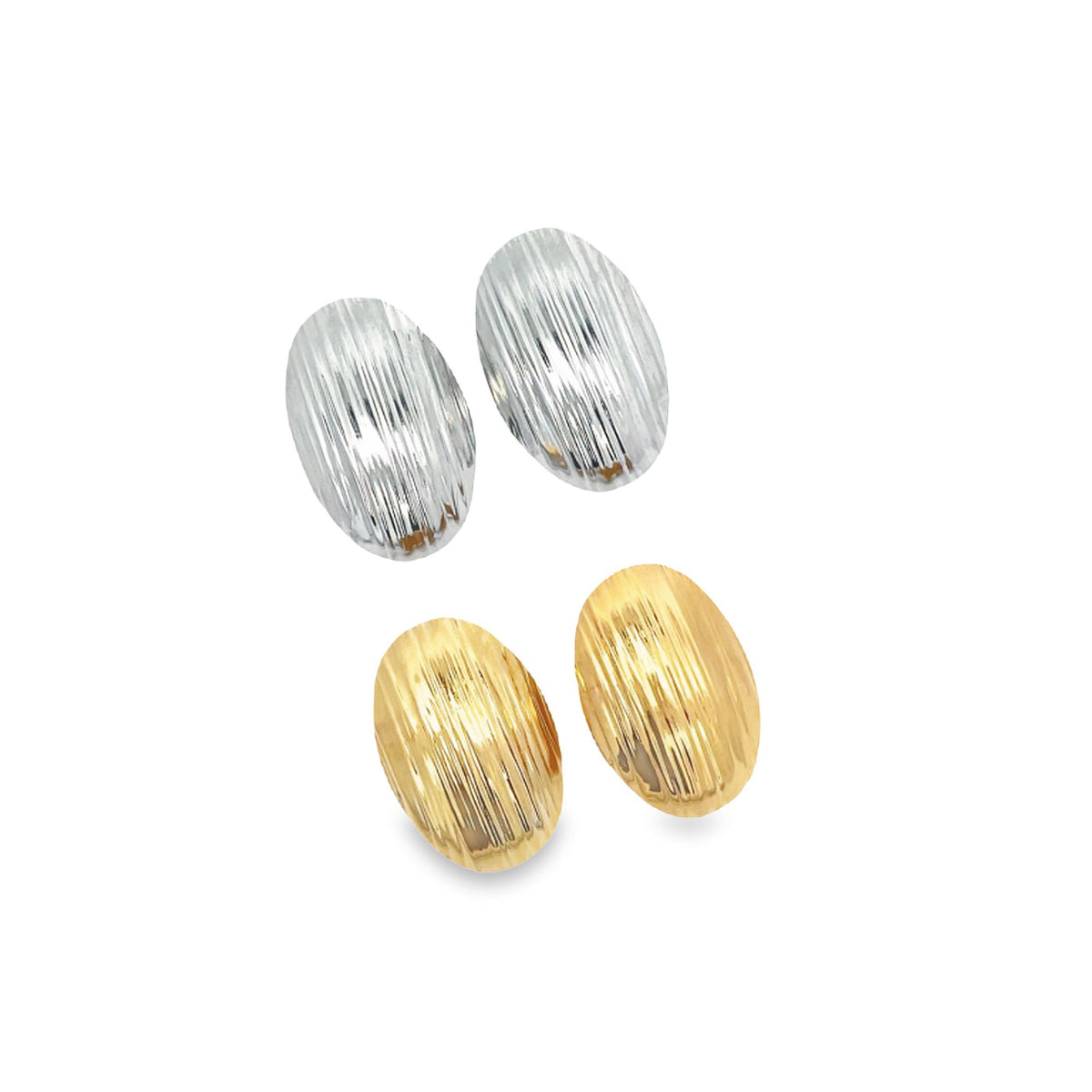 Two pairs of textured oval earrings in silver and gold rest on a clean white surface.