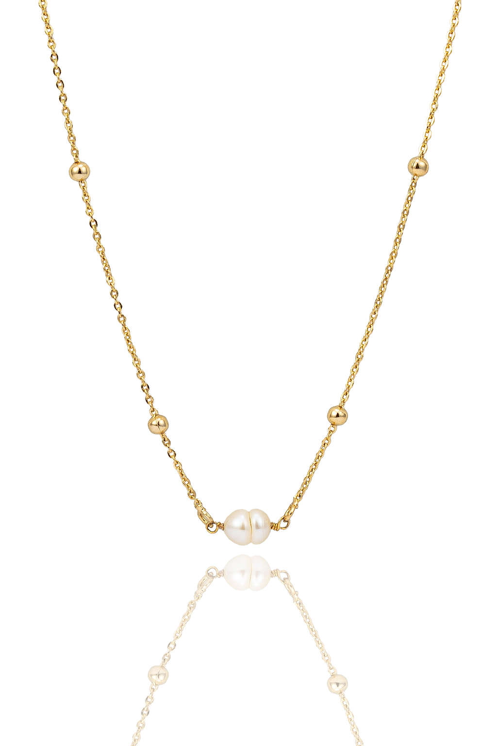 A delicate gold chain necklace features small metal beads and a central twin pearl pendant against a clean white background.