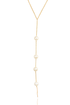 A delicate gold lariat necklace drapes vertically, featuring four evenly spaced white pearls.