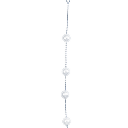A delicate silver chain dangles four lustrous white pearls vertically against a plain white background.