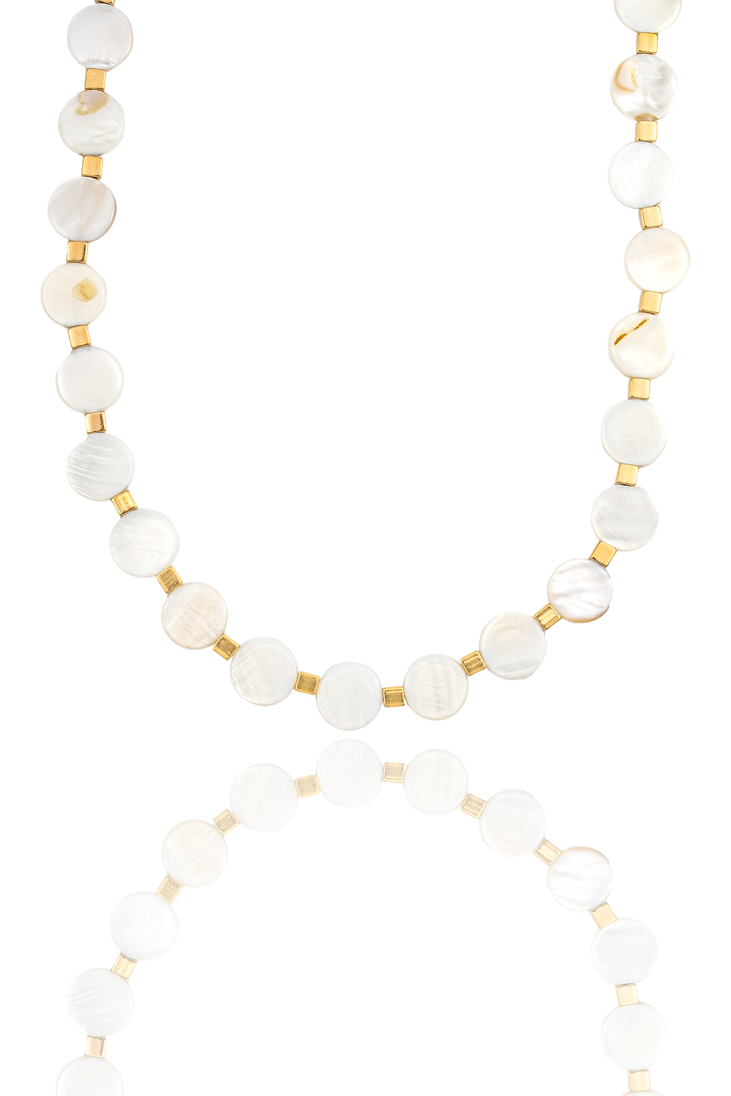 A mother-of-pearl coin bead necklace with gold spacers is displayed against a white background with a soft reflection underneath.