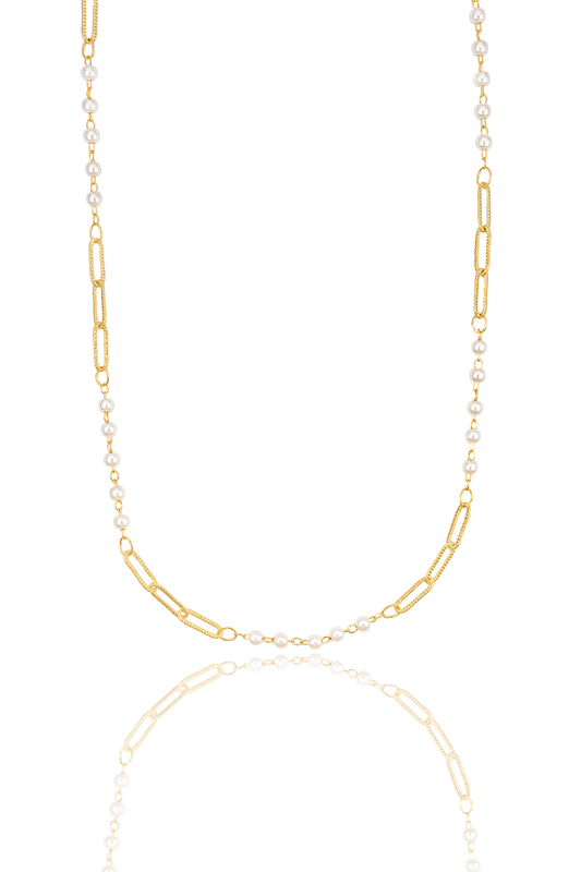 A delicate gold chain necklace combines interlocking links and small white pearls against a clean white background.
