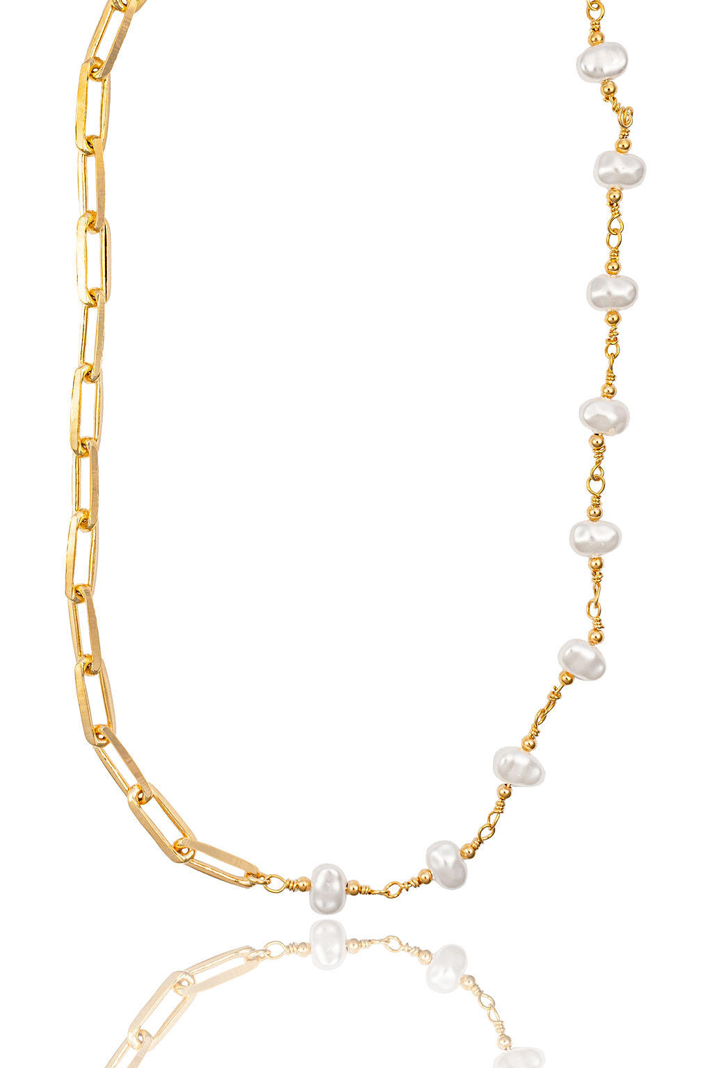 A gold chain and pearl necklace features chunky rectangular links on one side and delicate freshwater pearls strung on gold wire on the other.