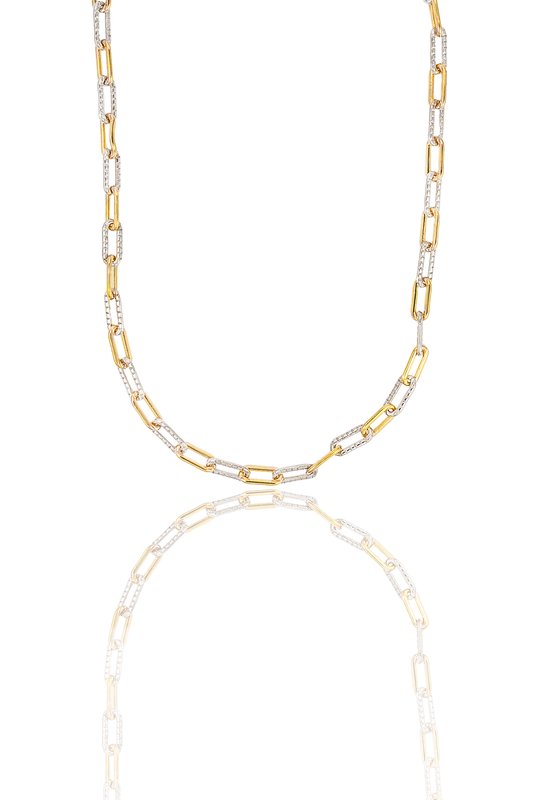 A two-tone paperclip chain necklace displays alternating links of polished yellow gold and textured white gold against a white background.