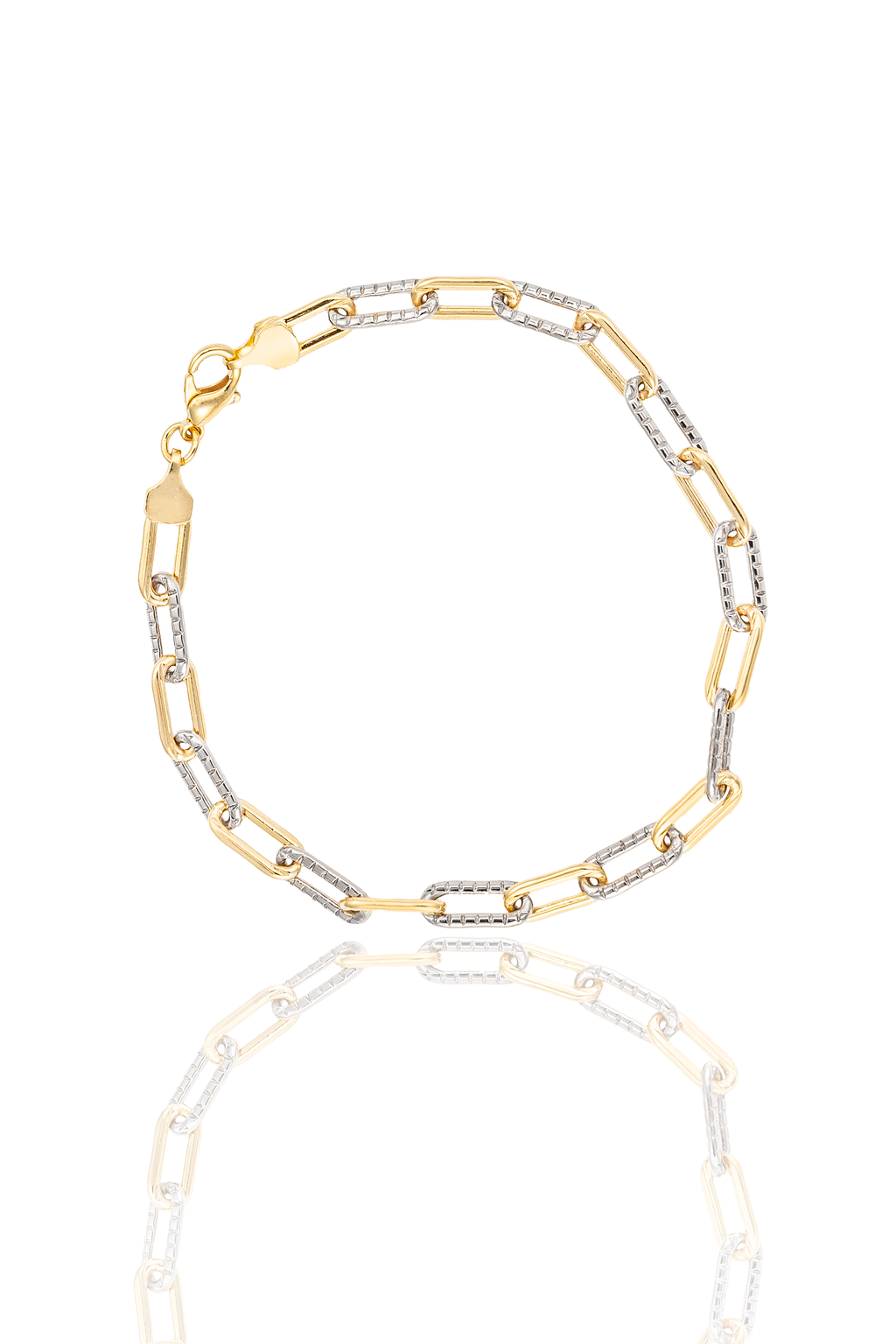 A two-tone paperclip link bracelet crafted from alternating yellow gold and textured white gold links rests on a white reflective surface.