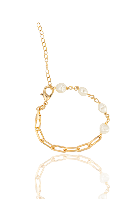 A gold link bracelet features scattered baroque pearls and an adjustable extension chain against a white background.