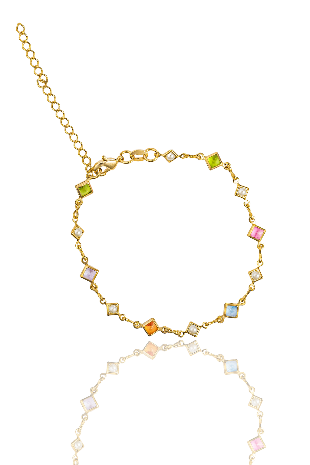 A delicate gold chain bracelet features alternating multicolored square gemstones and white pearls against a white background.