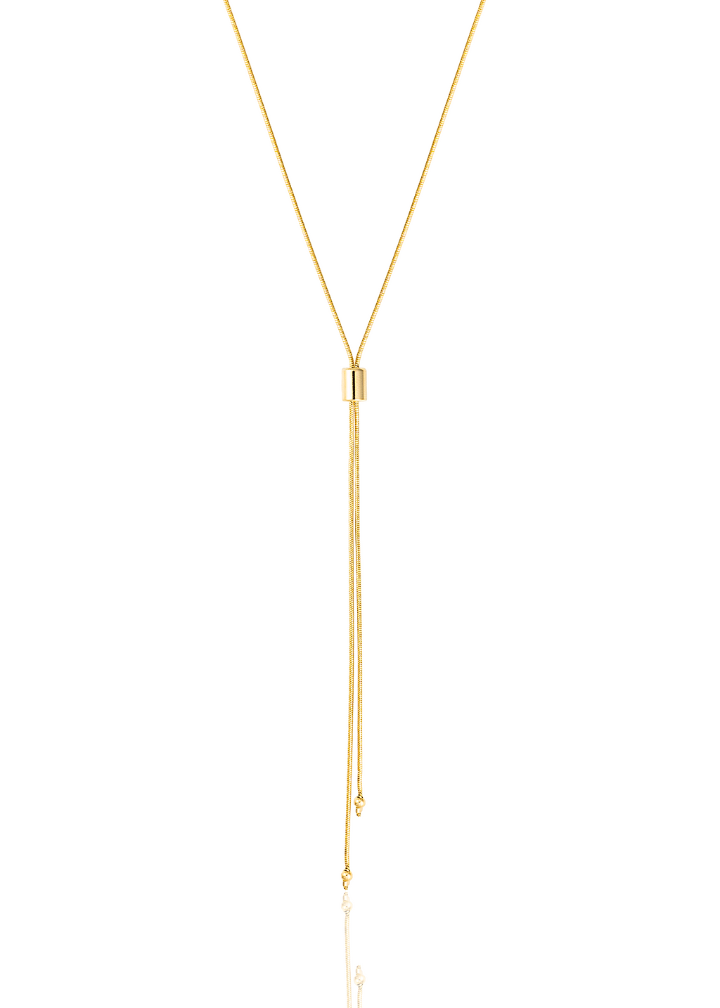 A delicate gold lariat necklace features a sliding cylinder bead and dangling chains ending in small spheres against a white background.